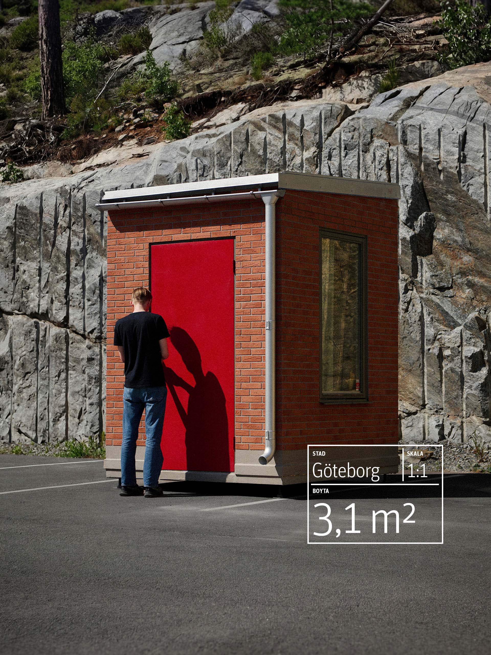 Man standing at red door of small brick structure near rocky hill in daylight. The text reads "Göteborg, Scale 1:1, 3,1m2"
